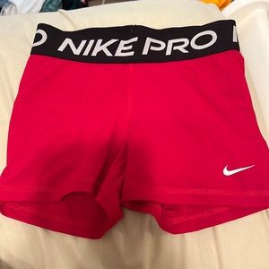 Women’s red size small nike pros!!! Worn only a few times!!